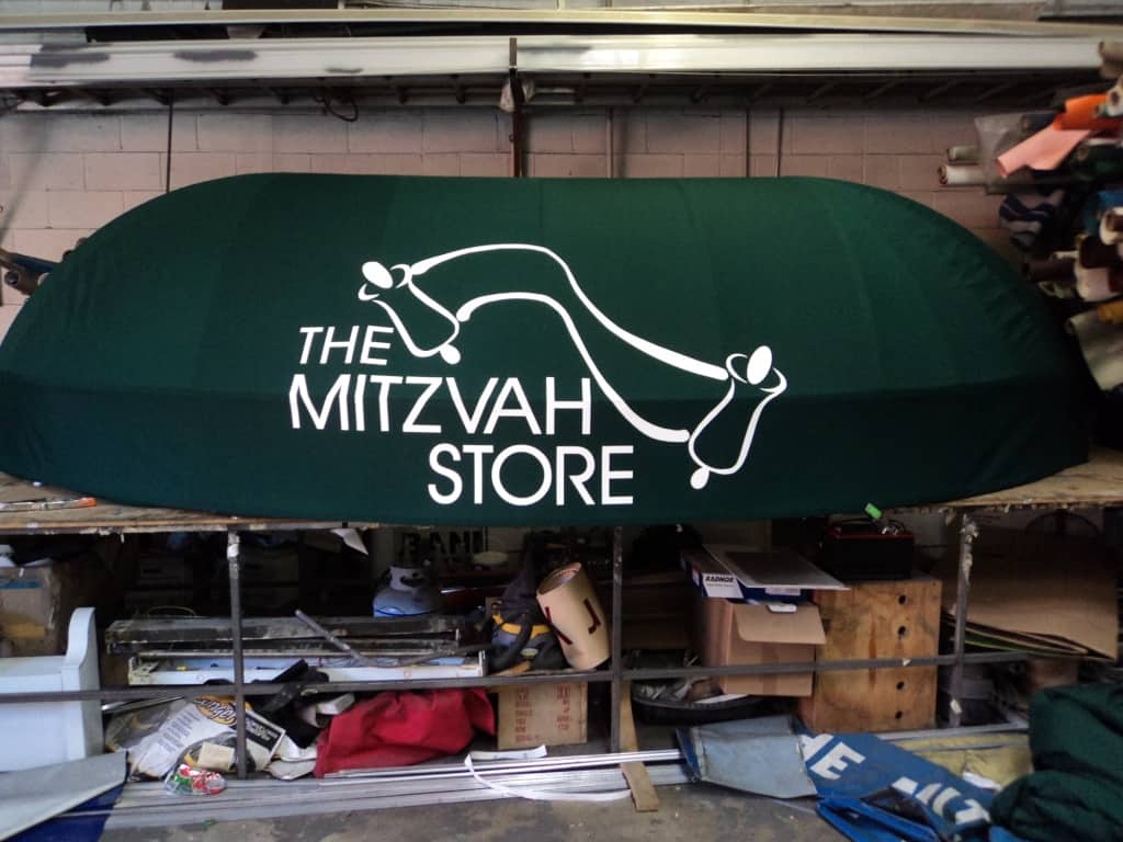 Green The Mitzvah Store Awning