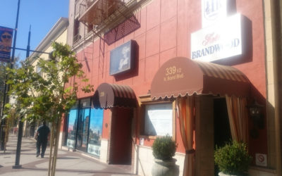 custom awnings on a red commercial building - custom commercial awnings - custom business awnings - commercial awning price - custom awning near me