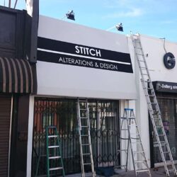 four stores with storefront awnings - custom awnings - custom awnings near me - custom awnings for decks - custom awnings for business - custom door awnings near me - spear awnings - aluminum awnings - dome awnings