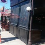 a black restaurant with black drapes - custom awnings - custom awnings near me - custom awnings for decks - custom awnings for business - custom door awnings near me - spear awnings - aluminum awnings - dome awnings