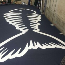 logo laid on a table - custom awnings - custom awnings near me - custom awnings for decks - custom awnings for business - custom door awnings near me - spear awnings - aluminum awnings - dome awnings