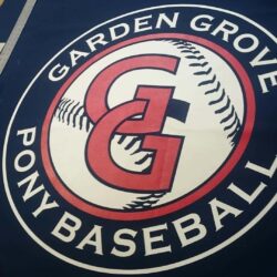 "Garden Grove Pony Baseball" sign laid on a table - custom awnings - custom awnings near me - custom awnings for decks - custom awnings for business - custom door awnings near me - spear awnings - aluminum awnings - dome awnings