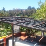 balcony with black slide on wire retractable awnings - custom awnings - custom awnings near me - custom awnings for decks - custom awnings for business - custom door awnings near me - spear awnings - aluminum awnings - dome awnings