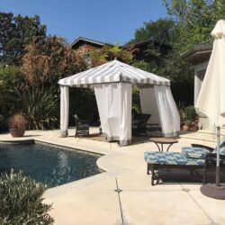 poolside corner with stripe cabana - custom awnings - custom awnings near me - custom awnings for decks - custom awnings for business - custom door awnings near me - spear awnings - aluminum awnings - dome awnings