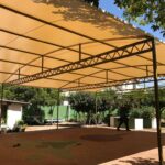 open space with white restaurant patio awning - custom awnings - custom awnings near me - custom awnings for decks - custom awnings for business - custom door awnings near me - spear awnings - aluminum awnings - dome awnings