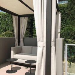 patio with a sofa and white cabana - custom awnings - custom awnings near me - custom awnings for decks - custom awnings for business - custom door awnings near me - spear awnings - aluminum awnings - dome awnings