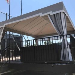 balcony with black railings and grey cabana - custom awnings - custom awnings near me - custom awnings for decks - custom awnings for business - custom door awnings near me - spear awnings - aluminum awnings - dome awnings