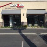Verizon store with grey awnings for entrance - custom awnings - custom awnings near me - custom awnings for decks - custom awnings for business - custom door awnings near me - spear awnings - aluminum awnings - dome awnings
