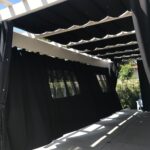 car parking area with black drapes - custom awnings - custom awnings near me - custom awnings for decks - custom awnings for business - custom door awnings near me - spear awnings - aluminum awnings - dome awnings