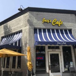 Joey's cafe with stripe blue awnings for entrance and window - custom awnings - custom awnings near me - custom awnings for decks - custom awnings for business - custom door awnings near me - spear awnings - aluminum awnings - dome awnings