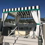 patio with black and white stripe cabana - custom awnings - custom awnings near me - custom awnings for decks - custom awnings for business - custom door awnings near me - spear awnings - aluminum awnings - dome awnings