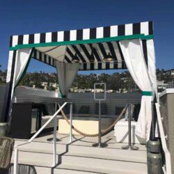 patio with black and white stripe cabana - custom awnings - custom awnings near me - custom awnings for decks - custom awnings for business - custom door awnings near me - spear awnings - aluminum awnings - dome awnings
