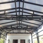 house with a cream residential awning - custom awnings - custom awnings near me - custom awnings for decks - custom awnings for business - custom door awnings near me - spear awnings - aluminum awnings - dome awnings