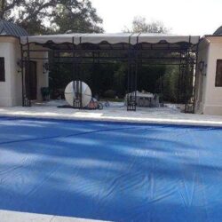 house with a cream residential awning - custom awnings - custom awnings near me - custom awnings for decks - custom awnings for business - custom door awnings near me - spear awnings - aluminum awnings - dome awnings