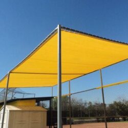 outdoor space with a yellow sail shade - custom awnings - custom awnings near me - custom awnings for decks - custom awnings for business - custom door awnings near me - spear awnings - aluminum awnings - dome awnings