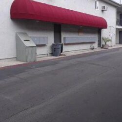 red round awning for a house with two windows and two air conditioner - custom awnings - custom awnings near me - custom awnings for decks - custom awnings for business - custom door awnings near me - spear awnings - aluminum awnings - dome awnings