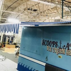 blue and white awnings for a blue ice cream truck - standard awnings - concave awnings - aluminum awnings - carports - store front awnings - patio shades