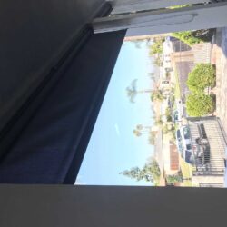 front deck with roll up curtains - custom awnings - custom awnings near me - custom awnings for decks - custom awnings for business - custom door awnings near me - spear awnings - aluminum awnings - dome awnings