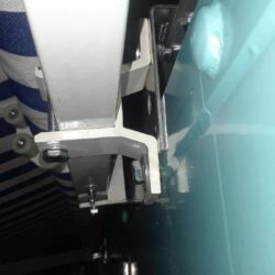 stripe blue awning installed on a house - custom awnings - custom awnings near me - custom awnings for decks - custom awnings for business - custom door awnings near me - spear awnings - aluminum awnings - dome awnings