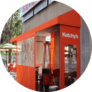orange drapes for Ketchy's - custom awnings - custom aluminum awnings - custom awning designs - custom awnings cost - retractable awnings - spear awnings - convex awnings - patio shades