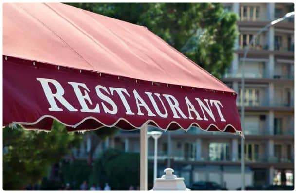A red restaurant awning in the front of a dining spot