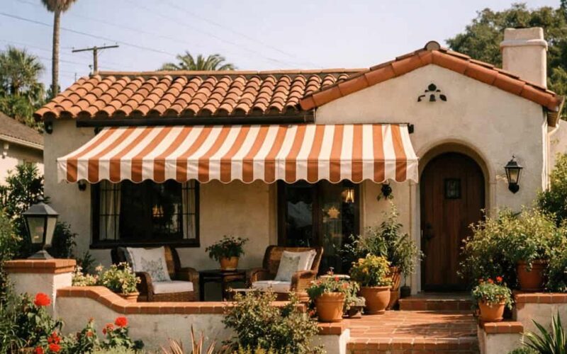 Shaded hillside patio under modern awning overlooking Northeast Los Angeles hills and downtown skyline at sunset